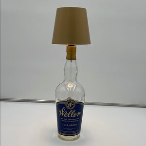 Bottle Lamp with Gold shade.